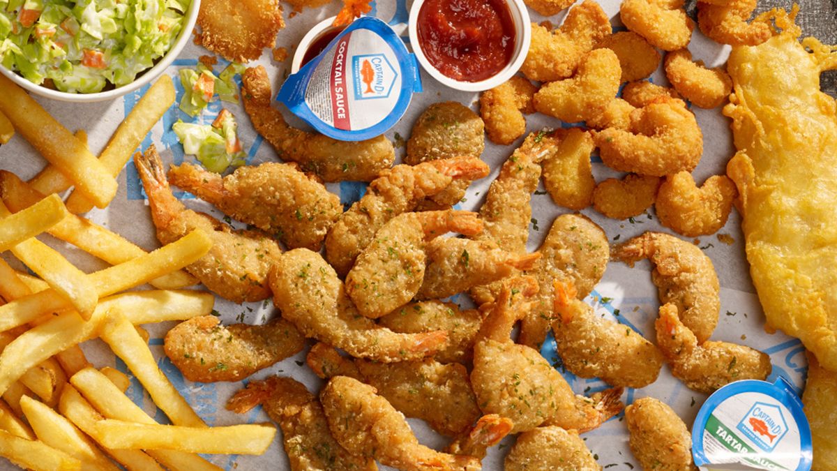 Captain D's Ketchup, Cocktail, and Tartar Sauce served with fried shrimp tails, fries, and hush puppies
