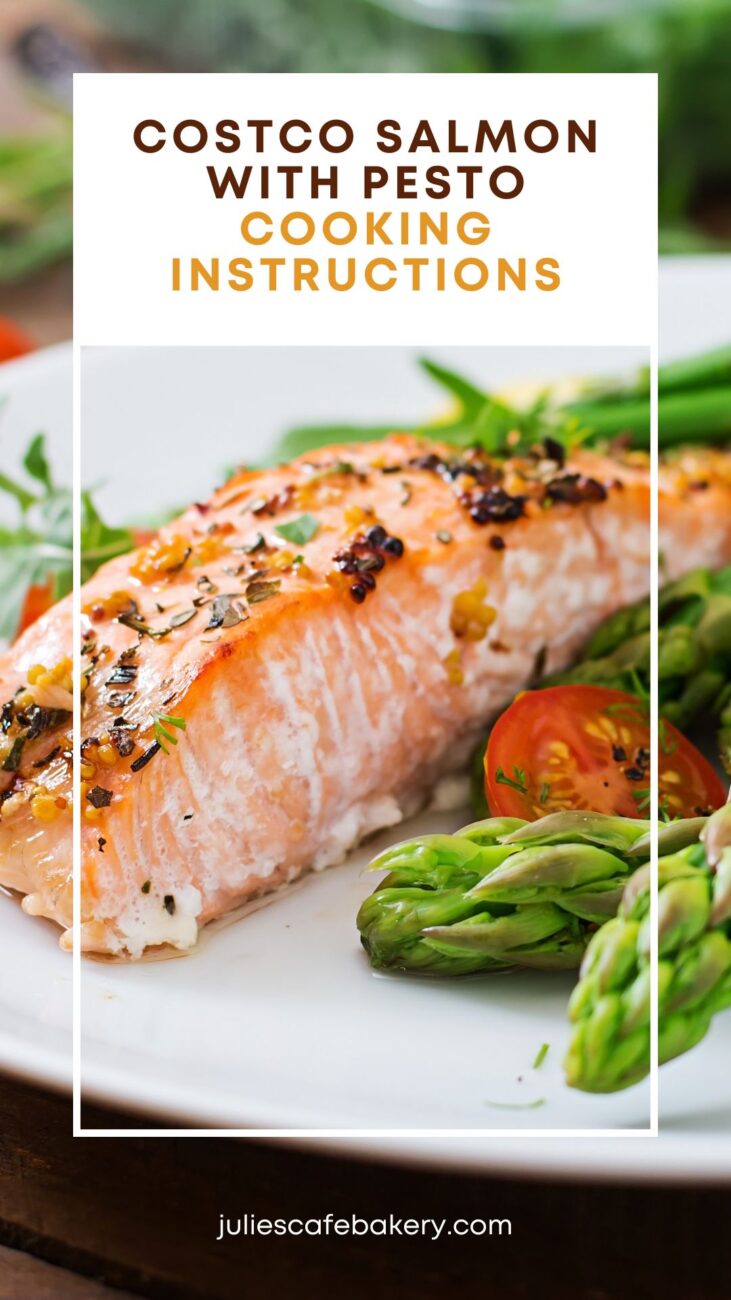 Costco Milano Salmon With Basil Pesto Butter served with roasted asparagus and fresh cherry tomatoes on a white plate with herbs