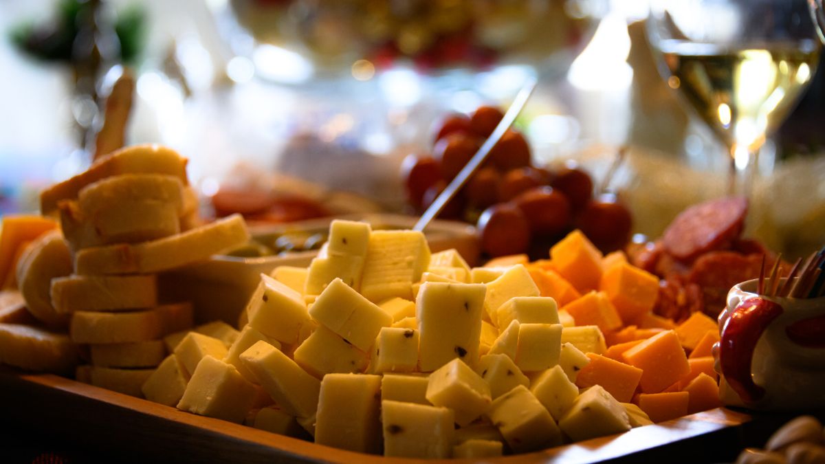 Muenster served cubed on a charcuterie board.