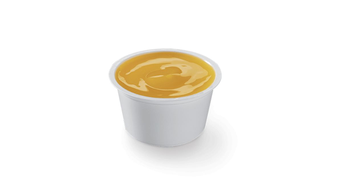 Little Caesars Caesar Dip Butter Garlic Flavor in a Plastic Dish on White Background
