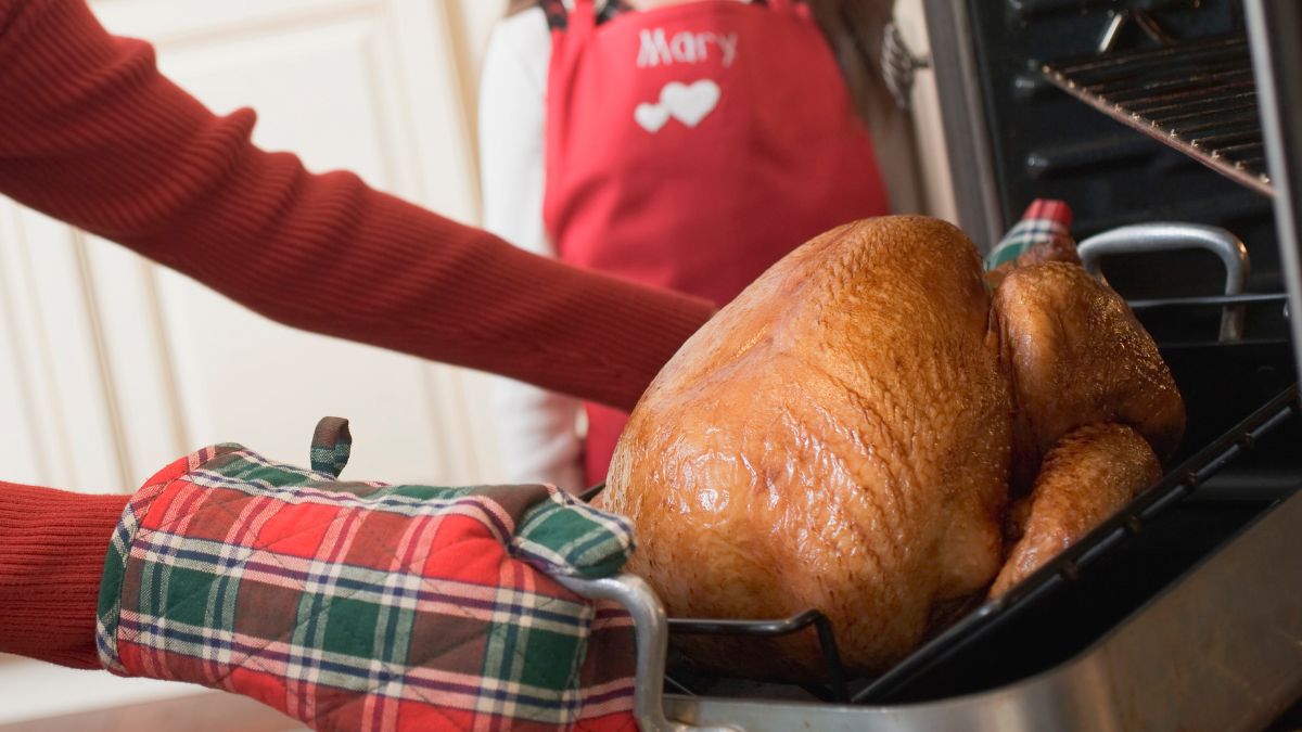 Putting Harris Teeter Frozen Turkey into the Oven After First Basting