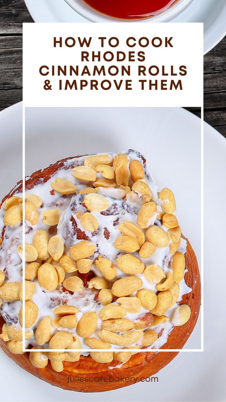 a freshly baked Rhodes Cinnamon Roll served with icing and topped with peanuts on a white plate next to a cup of tea