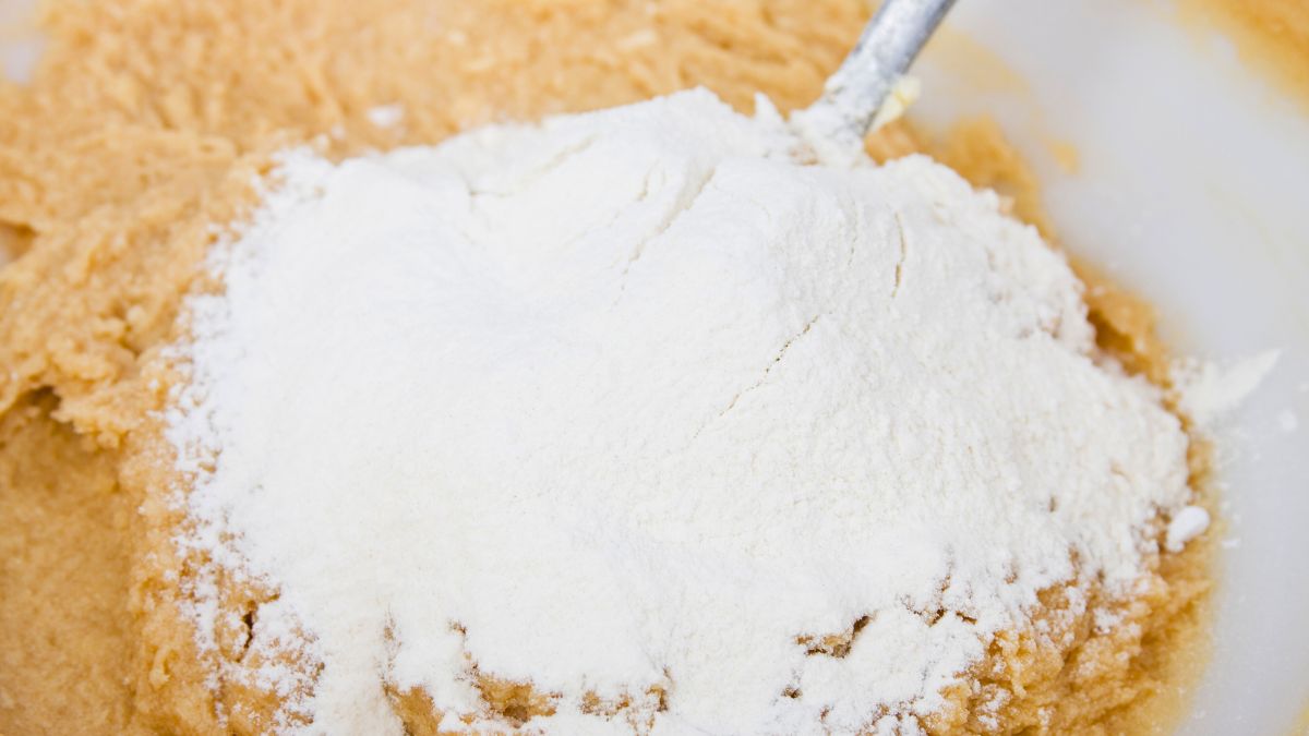 adding flour to cookie dough with too much butter