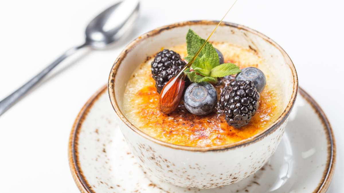 caramel dipped almond as decoration on Crème Brulée