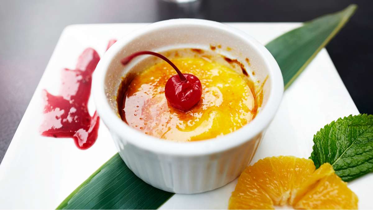 cherry compote as decoration on Crème Brulée