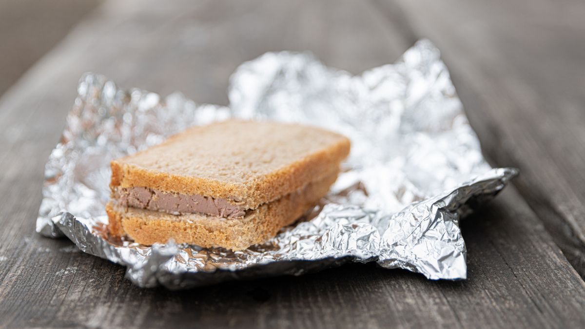 corn beef sandwich wrapped in aluminum foil