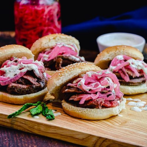 lamb sliders on cutting board