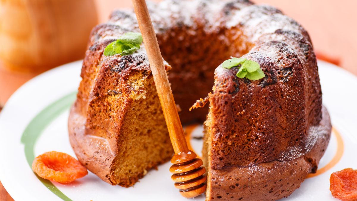 lekach cake missing a slice on a white plate