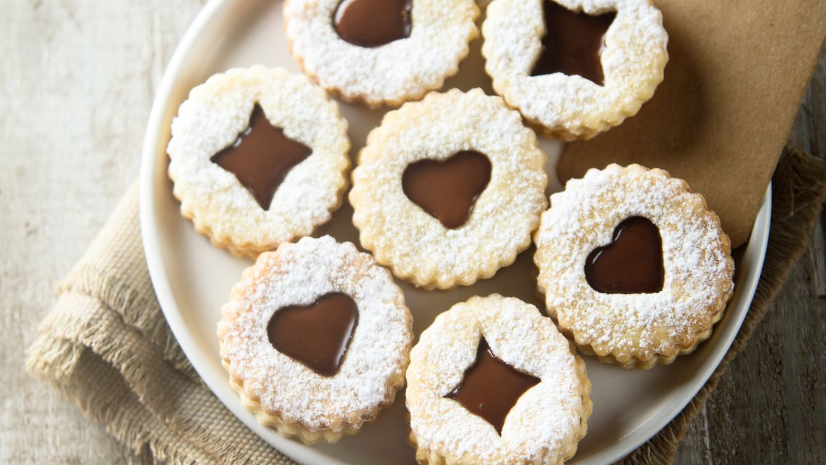linzer cookies on a white plate
