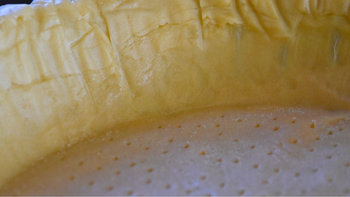 pie crust with too much shortening pricked all over with a fork