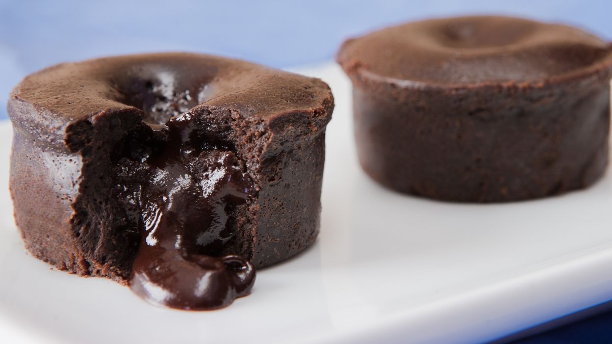 two lava cakes served on a white plate